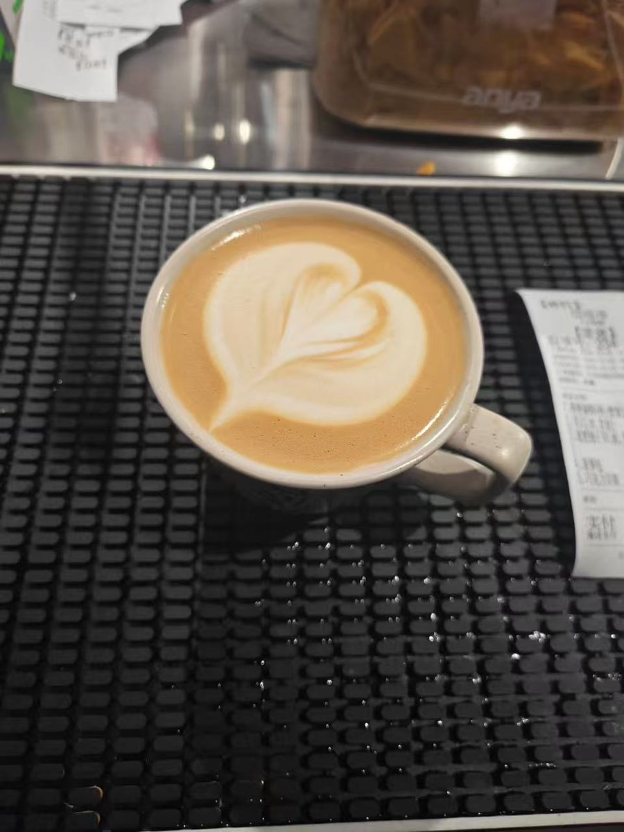 Heart latte art on a bar mat